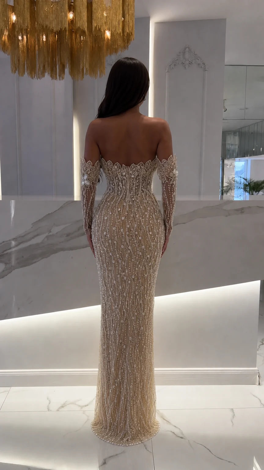 Back view of champagne floor-length beaded evening gown