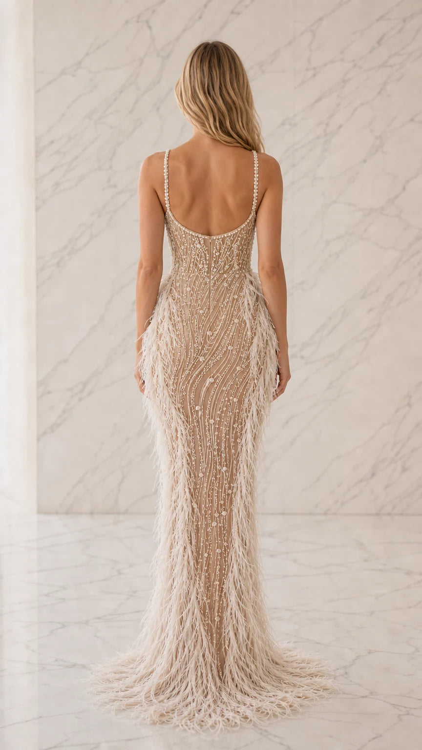 Back view of champagne low scoop back beaded evening gown