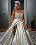 Elegant beaded satin wedding dress. Satin wedding dress with split thigh with sparkling beads
