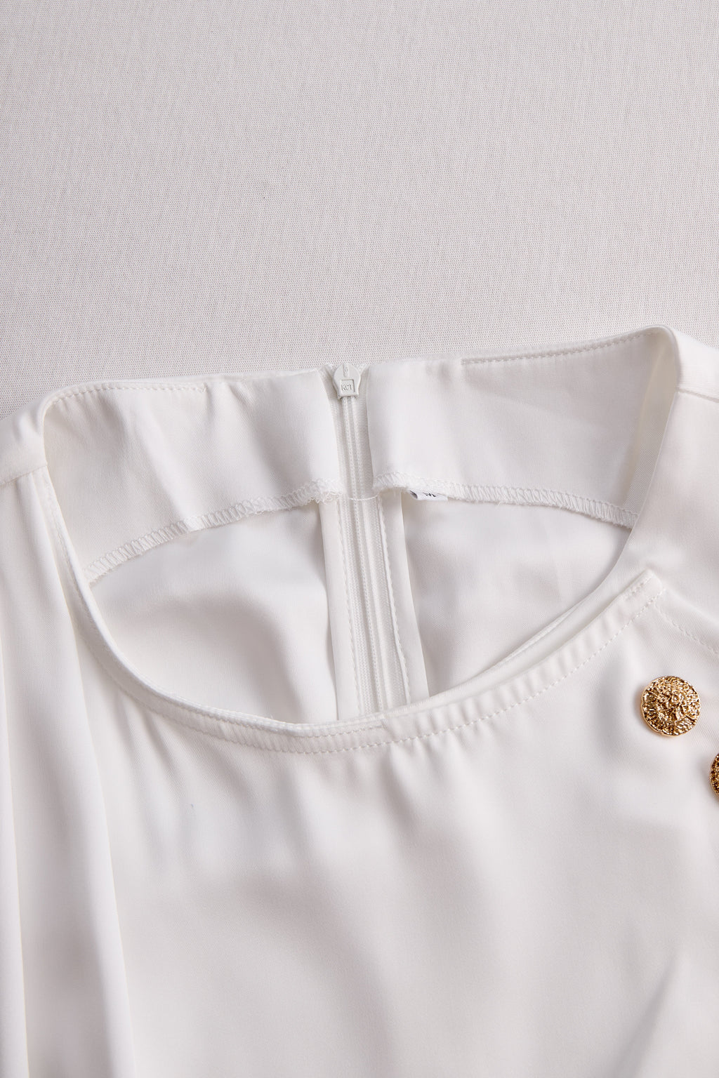 Elegant White Draped Top with Button Detail